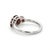 This elegant ring features a timeless trio of Garnet gemstones, admired for their deep red hue and rich, captivating...