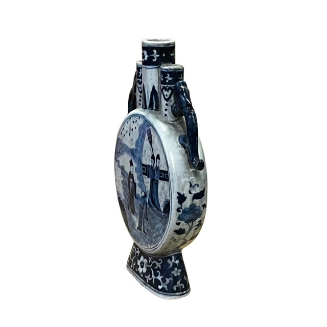 This is a Chinese decorative porcelain vase in a Blue and White color finish. The theme is an oriental people scenery...