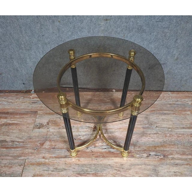 Brass and Glass Coffee/Side Table, Circa 1970 An elegant neoclassical style side or coffee table dating from the 1970s. It...