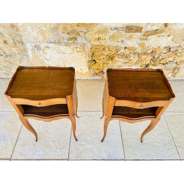Vintage, french, louis xv style pair of nightstands made of oak, circa 50's. resting on long, thin, slightly curved legs,...