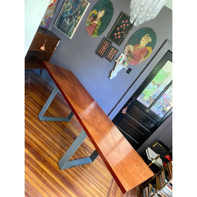 Gorgeous and super rare, solid Sapele Mahagony Slab disning table with custom solid steel leg bases. Just under 8’ long!...