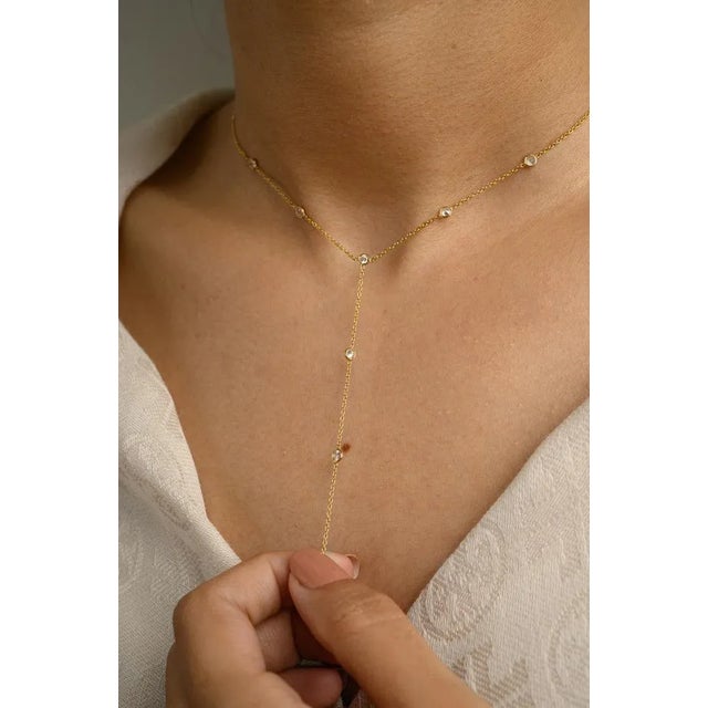 This is part of Chairish’s Fine Jewelry assortment. 1 Carat Diamond Lariat Necklace in 18K Gold studded with round cut...