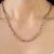 This timeless 18.5-inch Rivière tennis necklace features a continuous row of colorful round multisapphires, beautifully...