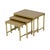 Vintage set of three nesting tables of graduated sizes, featuring brass frames and gold-toned glass tops with a marble...