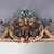 A striking French Louis XIV style polychromed and carved mirror, signed Niccolini and dating to the 20th Century. This...
