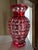 This exquisite piece features a striking ruby red overlay meticulously cut down to a clear layer, showcasing a...