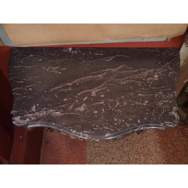 An absolutely amazing French hand carved walnut console with a black and white marble top. Louis XV period piece. Urn and...