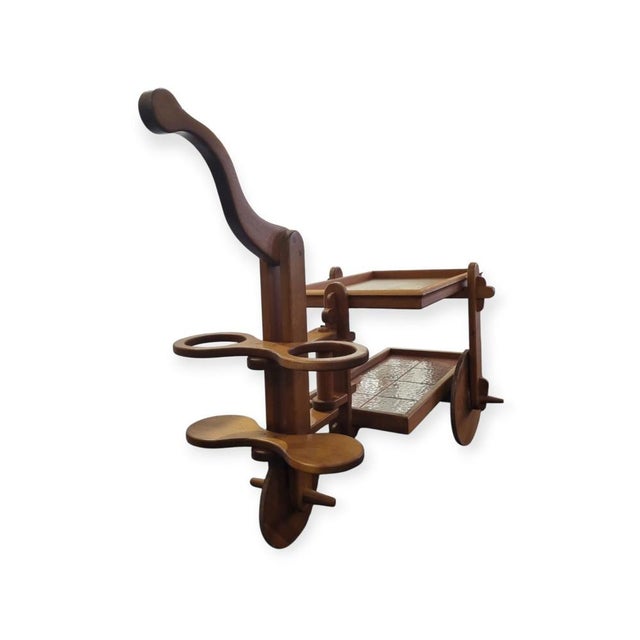 Rustic, organic vintage bar cart made of solid oak, from 1950s France. The top tray is removable, the bottom tray has...