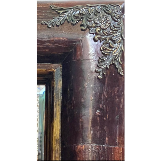 48"H x 40"W x 4"D This antique-style mirror evokes the elegance of Portuguese design with its richly detailed, dark-toned...