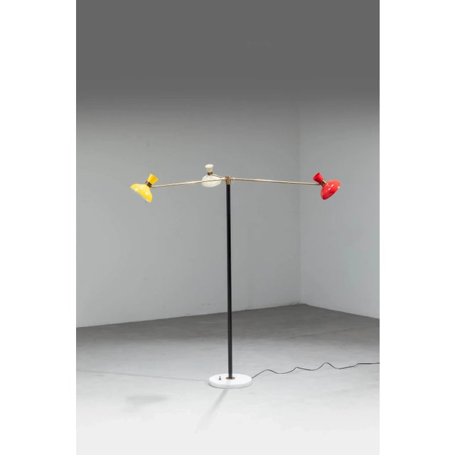 Painted metal structure, painted aluminum diffusers and brass details. Marble base. 1950s European Plug (up to 250V).The...