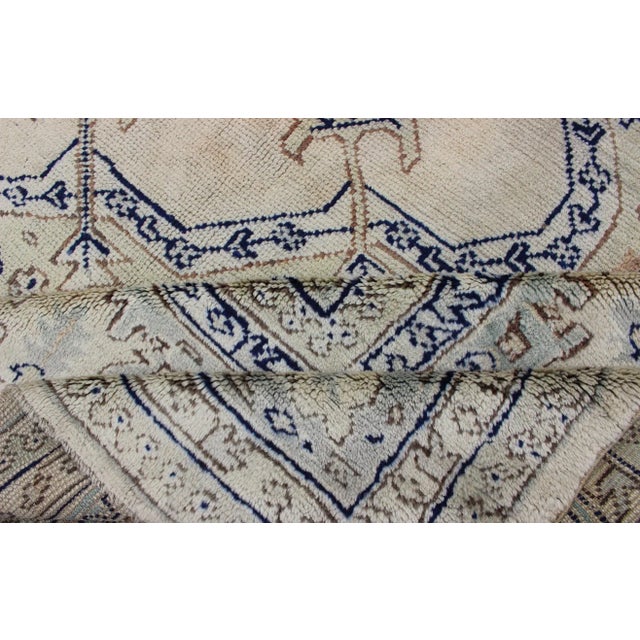 Early 20th Century Antique Turkish Oushak With Geometric Motifs in Champagne Field and Accent Blue For Sale - Image 12 of 12