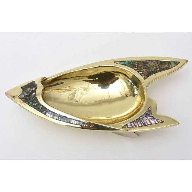 This mixed media vintage Los Castillo style Mexican bowl of polished silver plate, brass and abalone is hallmarked on the...