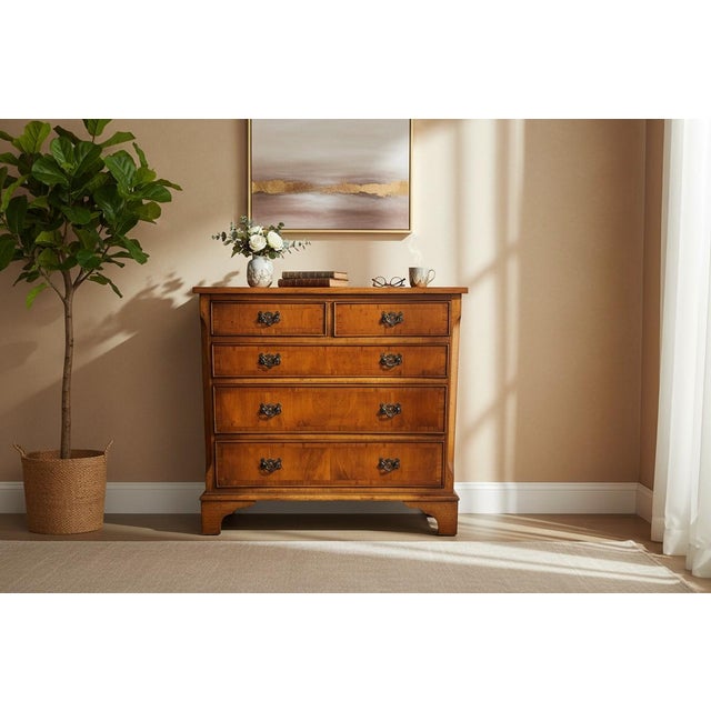 Beautiful vintage dresser crafted with warm wood tones and striking natural grain patterns. Featuring two upper drawers...