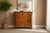 Beautiful vintage dresser crafted with warm wood tones and striking natural grain patterns. Featuring two upper drawers...