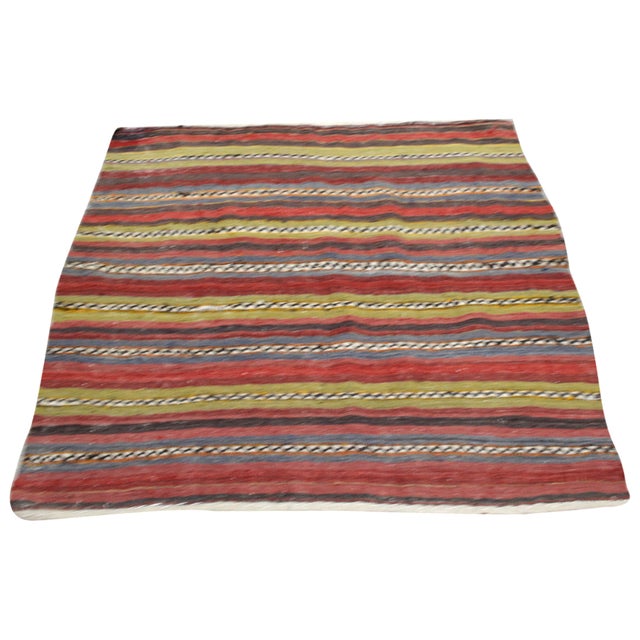 Hand-knotted with care using traditional rug-making techniques, this wool rug blends timeless craftsmanship with a modern...
