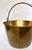 Circa 1860s. Hand crafted brass pot with copper brads and forged iron handle. Originally created for cooking, the cauldron...