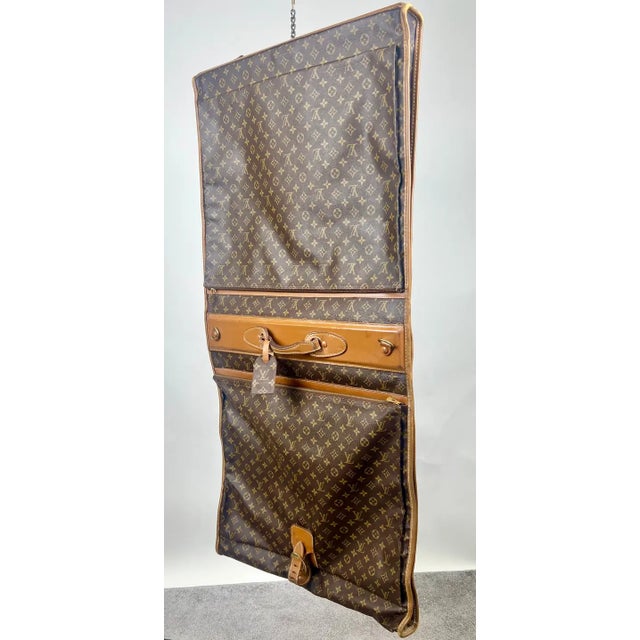 Louis Vuitton Vintage Monogram Garment Bag , Art of Travel This exquisite Louis Vuitton garment bag is a rare and...