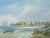 Oil painting of a Dutch riverscape with windmill and sailboats in the background, fishing vessels and figures in the...