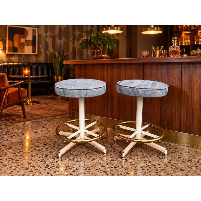 Vintage bar stools by Cal-Style Furniture Mfg. Co. are sold as a set of two. Each stool has a round swivel seat...