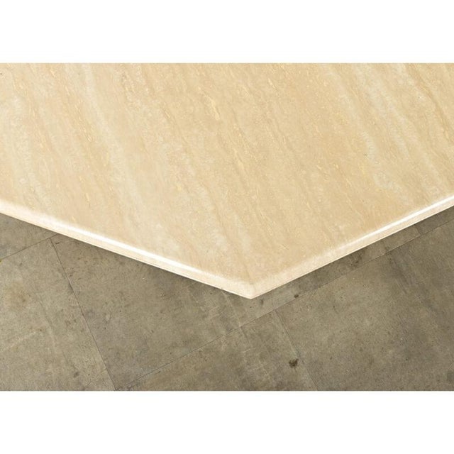 Dimensions: 14 ⅝” H x 35 ⅛” W x 35 ⅛” D This elegant 1970s French travertine coffee table has a clean and modern look yet...