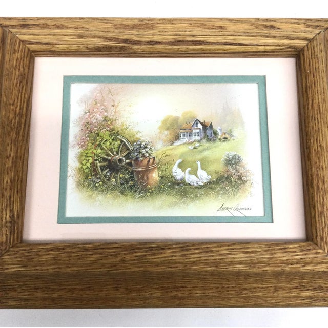 We love this earthy scene of white geese and wagon wheel. This print has been lovingly framed in a heavy solid oak frame....