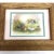 We love this earthy scene of white geese and wagon wheel. This print has been lovingly framed in a heavy solid oak frame....
