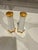 Lovely white porcelain salt & pepper shakers. Love this style with gold tops and around the bottom! Newer plastic stoppers.