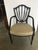 Elegant and graceful hand carved mid-19th century shield back Hepplewhite armchair. The dark mahogany frame is expertly...
