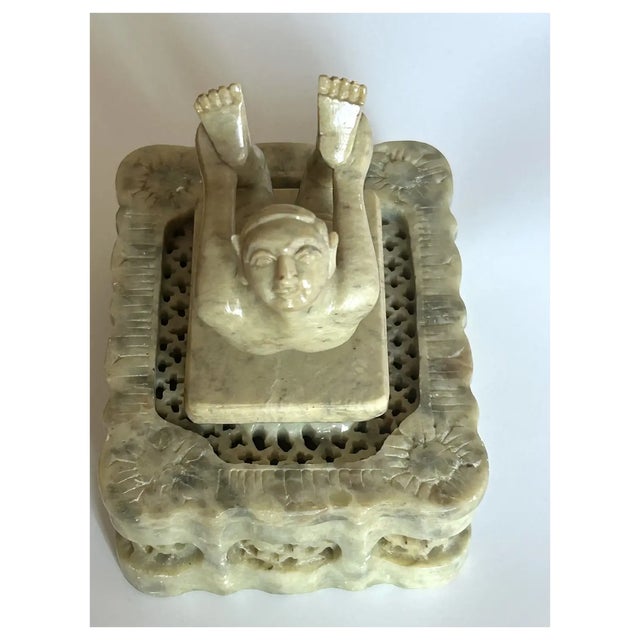 One of a kind, unusual hand carved little trinket box. I brought the 2 pieces together, the Yogi and the pireced carving...