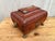Antique English Regency period leather jewelry box, c.1820 In red leather, having a bombé shaped body and stepped lid....