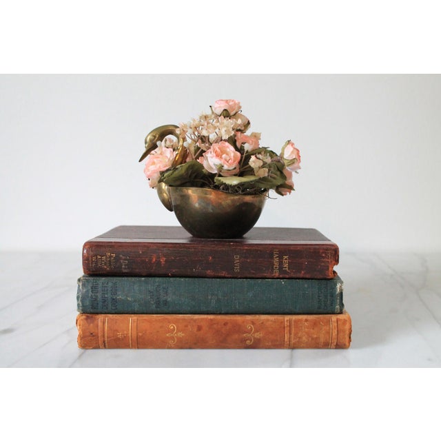 Vintage brass swan dish. Made in India. Some patina and residual glue inside dish. Faux flowers not included.