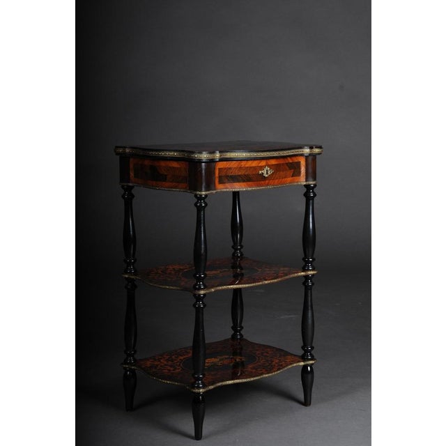 19th century Marquetry side table with jewelry box, circa 1870 3-tier side table with decorative key function. Solid wood...