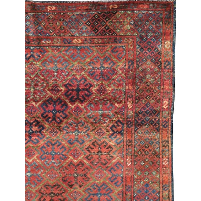 A vintage Afghan Baluch carpet from the second quarter of the 20th century. Measures: 3' 4" x 4' 9"