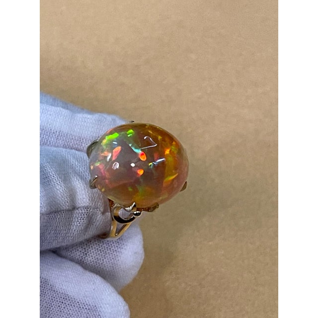 12 Carat Oval Shape Ethiopian Opal Cocktail Ring 14 Karat Yellow Gold size 6.5 Oval Natural Opal A classic, Cocktail ring...