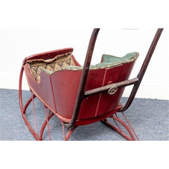 Fantastic rustic antique late 19th to early 20th C. Child’s push sleigh. Carved oak arms connect with a wonderfully turned...
