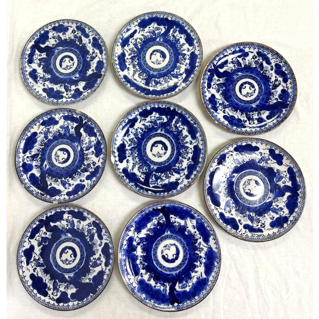 Great set of eight antique porcelain decorative plates from the early 1900's. Each is painted with Asian imagery in a rich...