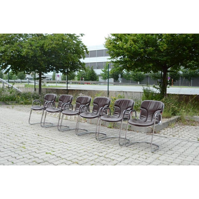 These Italian design chairs are produced from Italian manufacture Cidue. It has a polished chromed steel base and...