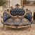 Make a dramatic statement with this exquisite French Louis XV-style settee, featuring an ornate carved frame finished in...