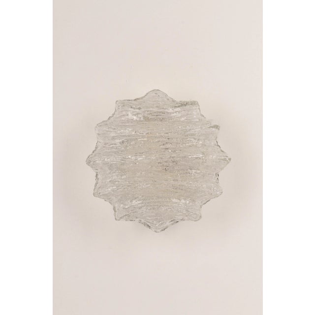 Wonderful wall light, from limburg glashütte, germany, circa 1960-1970. Ice glass on a black metal base. Heavy quality and...
