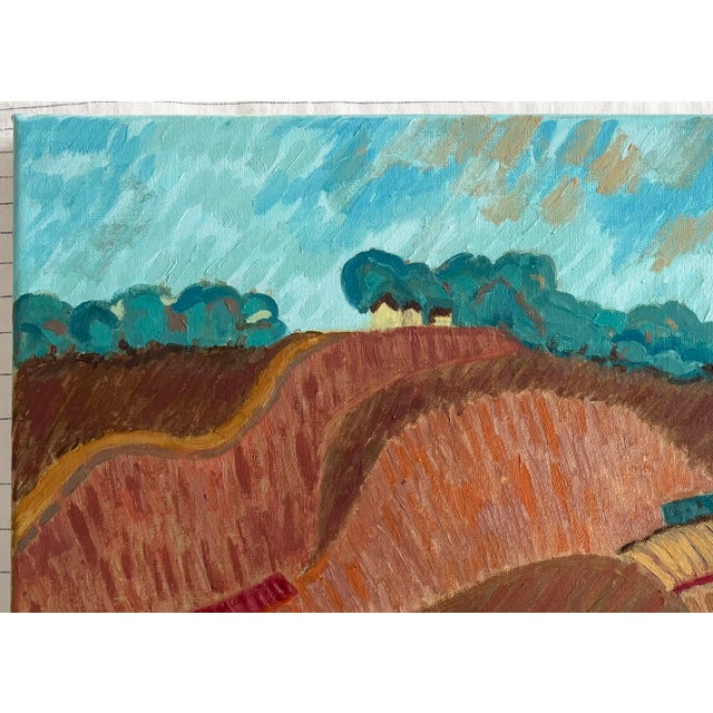 Abstract impressionist landscape of hillside fields in colors of rusts, browns, crimson against blue-green trees and sky....