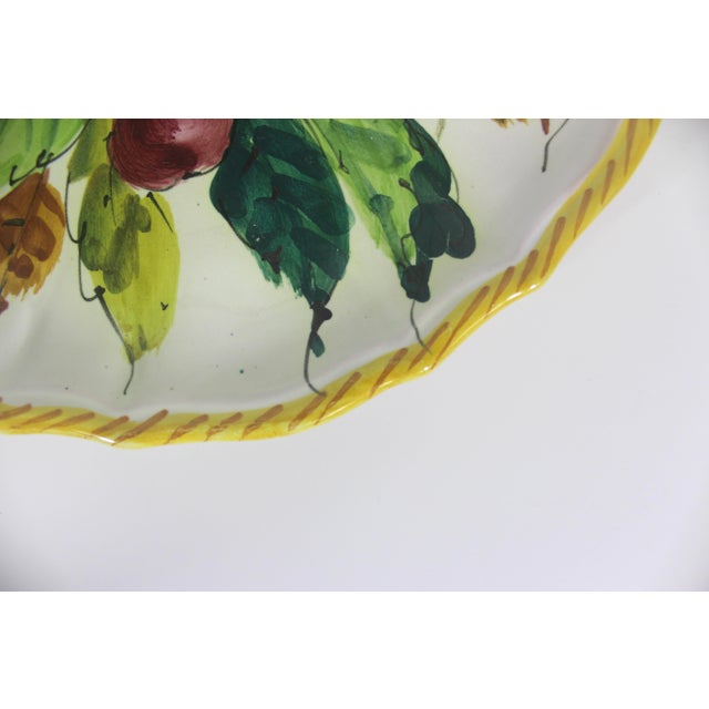 Vintage hand painted apple cherry fruit large ceramic plate with a scalloped edge and yellow rope detail. This is in very...