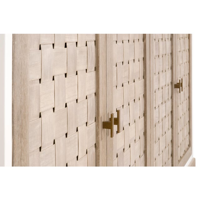 The Weave Media Sideboard from Essentials For Living is a stunning piece that combines functionality and unique style....