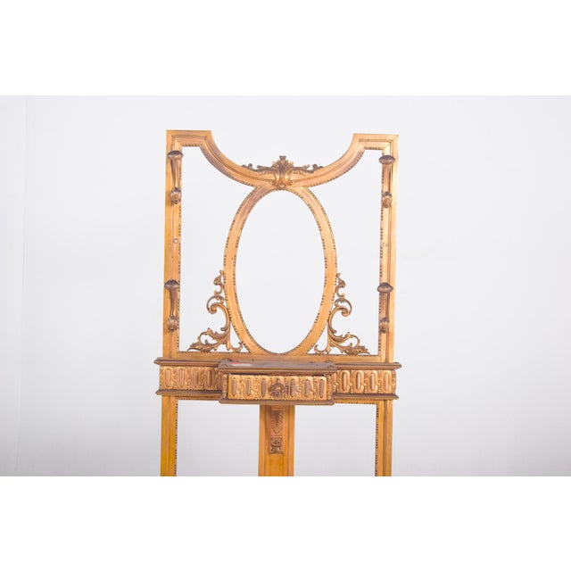 This elegant coat stand, crafted in iron and painted in a rich golden finish, dates from the early 20th century. Its...