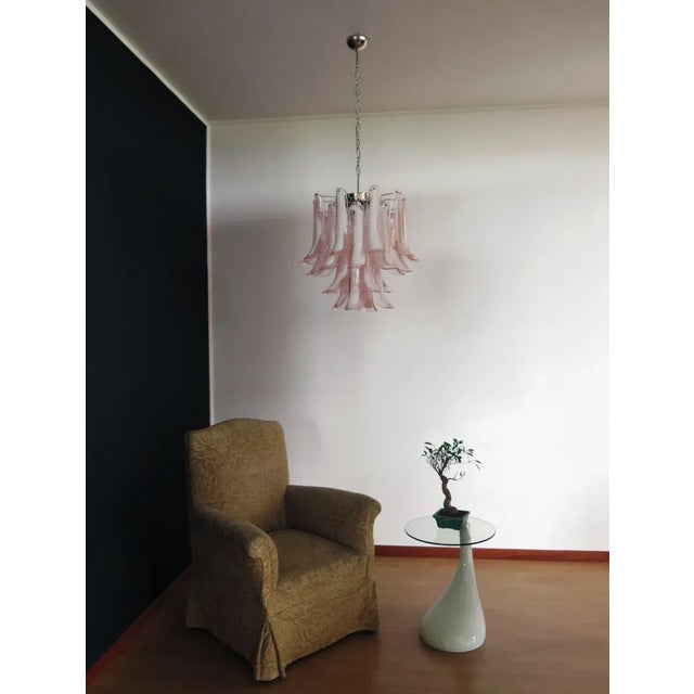 Italian vintage Murano chandelier made by 26 glass petals (pink and white “lattimo”) in a chrome frame. Dimensions: 47,250...