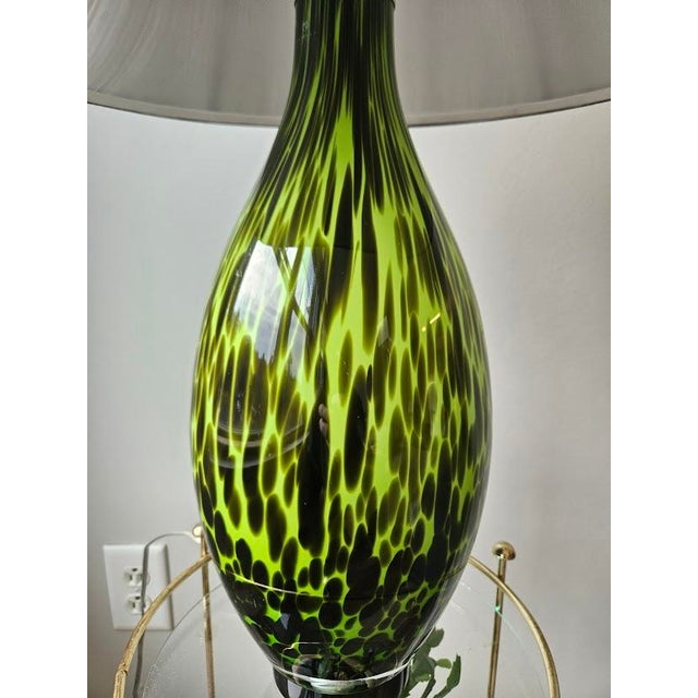 Stunning green & black striped table lamp by Kodax. The shade is in great condition as well. Zodax was founded in 1990 and...
