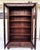 An antique bookcase/display cabinet made of solid oak and pine, dating back to the early 20th century and featuring an...