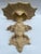 A single vintage chinoiserie style figural wall bracket or shelf with matte finish.