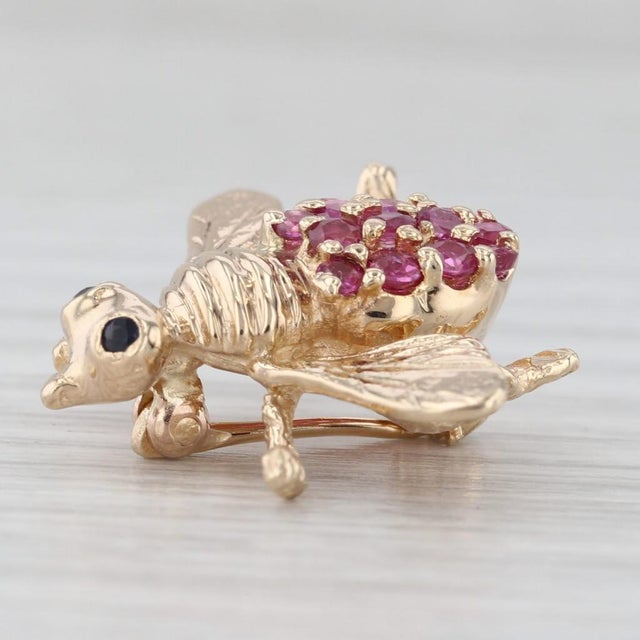 Gemstone Information: - Natural Rubies - Total Carats - 0.54ctw Cut - Round Color - Red Treatment - Routinely Enhanced -...
