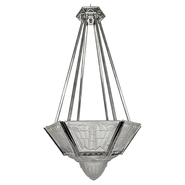 A French Art Deco chandelier signed by the French artist "Verrerie des Hanots". The chandelier consists of six-sided...