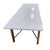 This is a beautiful vintage coffee table in the style of Paul McCobb. The base is square tubular brass, with a classical X...
